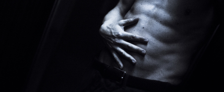 Nude sporty slim attractive muscular fit male model man naked with strong six pack abs, obliques muscles, chest and arms.の写真素材