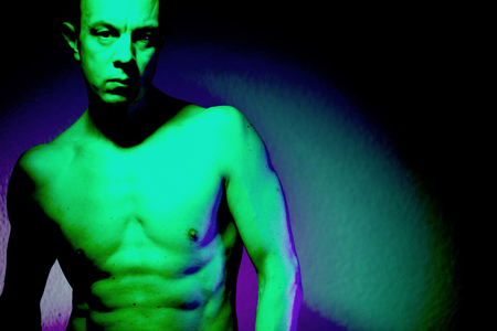 Nude sporty slim attractive muscular fit male model man naked with strong six pack abs, obliques muscles, chest and arms.の写真素材