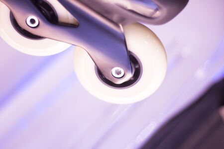 Freestyle inline skates boots and wheels in retail store shop window for free, urban, slalom, fitness and recreational skating.の写真素材