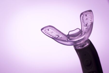 Teeth invisible brackets orthodontic dental tooth vibrator to accelerate orthodontics alignment straightening dentist treatment.の写真素材