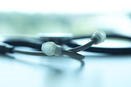 Doctors medical stethoscope heart rate monitoring equipment to listen to heartbeats of patient,