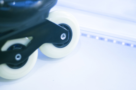 Freestyle inline skates boots and wheels in retail store shop window for free, urban, slalom, fitness and recreational skating.の写真素材