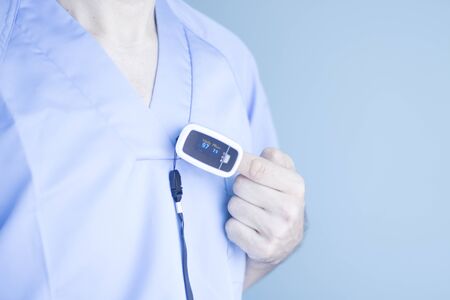 Blood pressure finger resting pulse monitor used to take heart rate and irregular beats with...