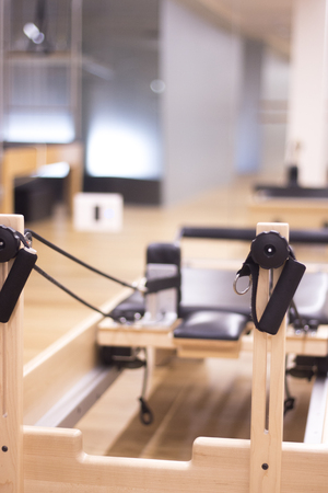 Yoga and pilates studio gym with training equipment for exercise, rehabilitation, physical therapy and workout.の写真素材