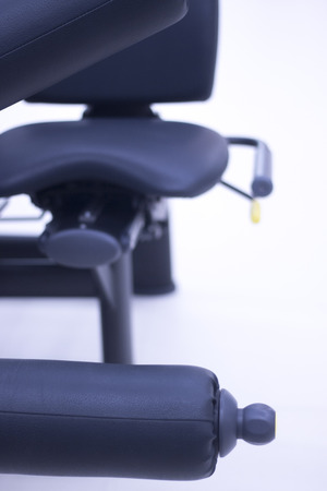 Leg weights extension for quadriceps and curl for hamstrings gym machine resistance workout equiment.の写真素材