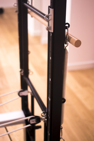 Pilates exercise training and flexibility stretching machine in gym yoga and wellbeing studio.