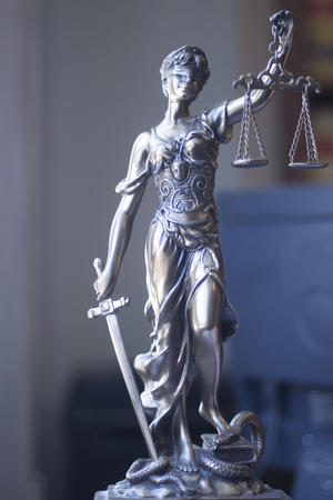 Law offices of lawyers legal statue Greek blind goddess Themis bronze metal statuette figurine with scales of justice.の写真素材