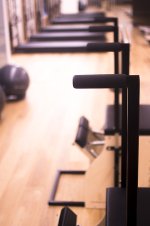 Pilates exercise training and flexibility stretching machine in gym yoga and wellbeing studio.
