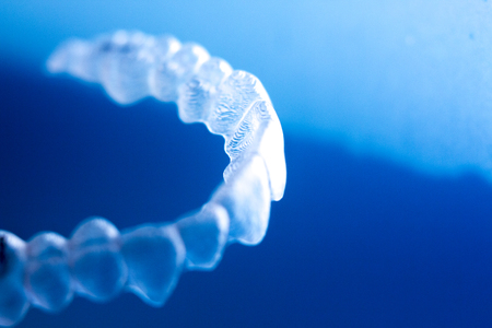 Invisible dental bracket aligners for modern orthodontic treatment to straighten teeth and improve...