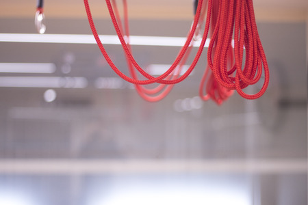 Yoga and pilates studio gym with red cord training equipment for exercise, rehabilitation, physical therapy and workout.の写真素材