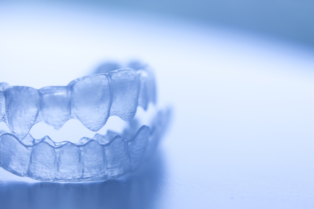 Invisible dental bracket aligners for modern orthodontic treatment to straighten teeth and improve...