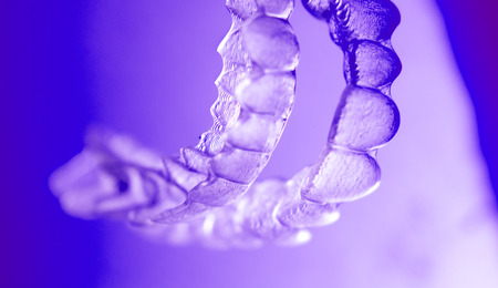Invisible dental bracket aligners for modern orthodontic treatment to straighten teeth and improve...