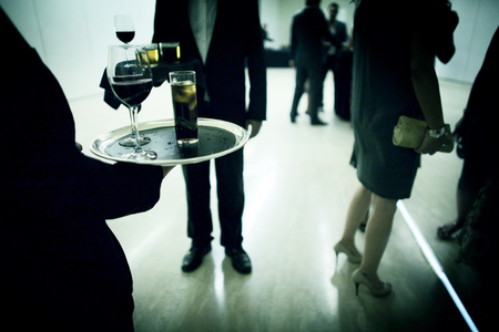 VIP wedding party evening marriage drinks reception with waiter and guests in Ibiza Spain.のeditorial素材