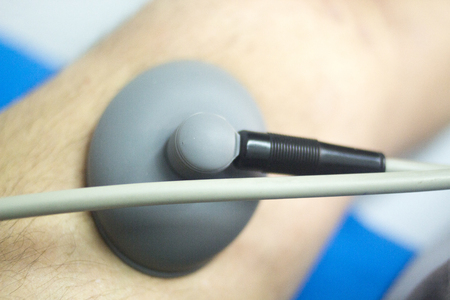 Physical therapy mecical clinic physiotherapy electrical impulse shock treatment for leg injury...