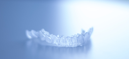 Invisible dental bracket aligners for modern orthodontic treatment to straighten teeth and improve...