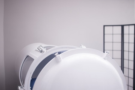 HBOT hyperbaric oxygen therapy tank chamber in hospital clinic to treat patients for diseases and medical conditions.の写真素材
