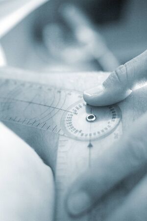 Physical therapy mecical clinic physiotherapy treatment measuring range of movement in patient ankle injury rehabilitation.の写真素材