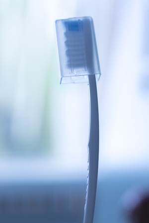 Dental toothbrush to clean teeth isolated in bathroom closeup.の写真素材