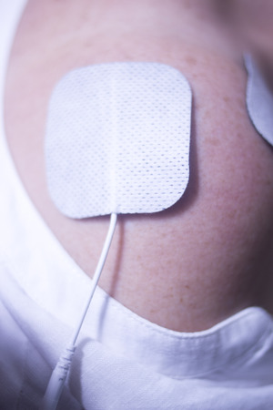 Physical therapy mecical clinic physiotherapy electrical impulse shock treatment for leg injury rehabilitation.の写真素材