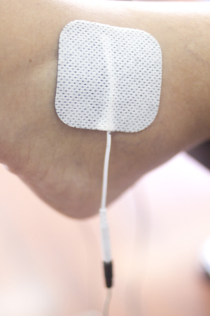 Physical therapy mecical clinic physiotherapy electrical impulse shock treatment for leg injury rehabilitation.の写真素材