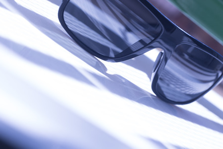 Men's fashion sunglasses. Dark tinted UV protection glasses used to protect the eyes from the sun.の写真素材