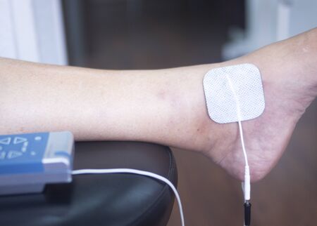 Physical therapy mecical clinic physiotherapy electrical impulse shock treatment for leg injury...
