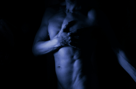 Sexy male nude slim athletic man with naked torso, chest and abs. Toned athletic physique with natural non steroid look.の写真素材