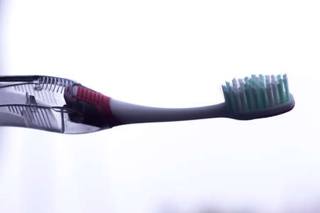 Manual modern tooth brush closeup on plain background.の写真素材