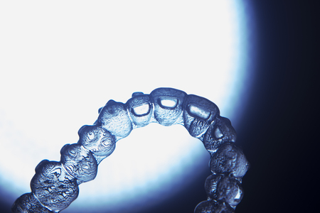 Invisible teeth retainers orthodontic brackets. Plastic modern straighterners to correct tooth...