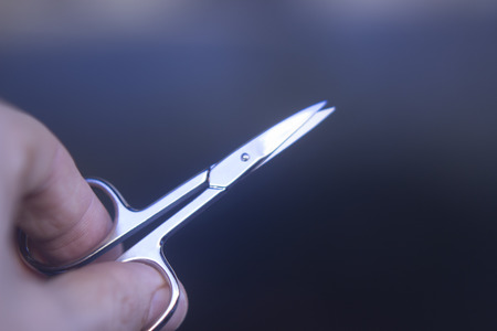 Manicurel nail scissors to cut nails on hands and toenails in beauty treatment and personal care.の写真素材