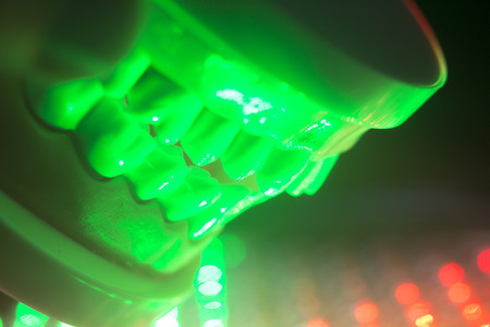 Dental teeth orthodontic dentistry teachng model with gums, tooth enamel, plaque, roots and metal implants.の写真素材