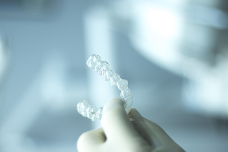 Invisible teeth retainers orthodontic brackets. Plastic modern straighterners to correct tooth...