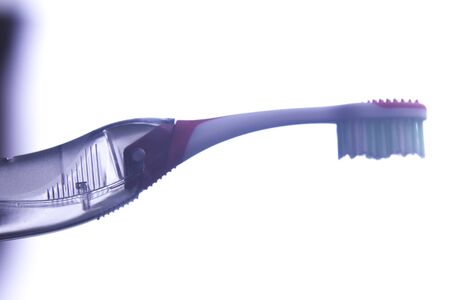 Manual modern tooth brush closeup on plain background.の写真素材