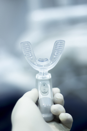 Dental bracket aligner accelerator vibrator for orthodontic straighteners, brackets and aligners.の写真素材