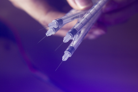 Medical needle injection for diabetic insulin and vaccine injections on patients in medical treatment.の写真素材