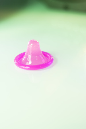 Rubber latex condom male contraceptive for safe disease and pregnancy free sex.の写真素材