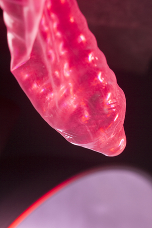 Rubber latex condom male contraceptive for safe disease and pregnancy free sex.の写真素材