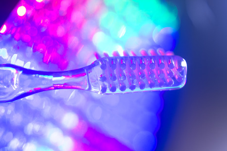 Dental toothbrush closeup isolated on abstract backgroundの写真素材