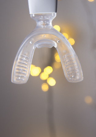 Dental bracket aligner accelerator vibrator for orthodontic straighteners, brackets and aligners.の写真素材