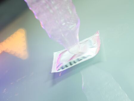 Rubber latex condom male contraceptive for safe disease and pregnancy free sex.の写真素材