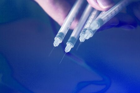 Medical needle injection for diabetic insulin and vaccine injections on patients in medical treatment.の写真素材