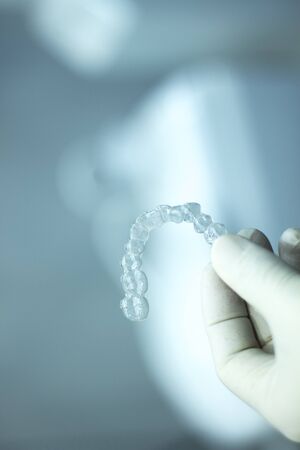 Invisible teeth retainers orthodontic brackets. Plastic modern straighterners to correct tooth...