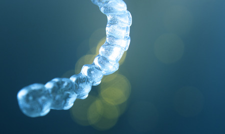 Invisible teeth retainers orthodontic brackets. Plastic modern straighterners to correct tooth...