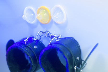 Bondage sadomasochism sex games erotic handcuffs for bdsm dominance sex and condoms.の写真素材