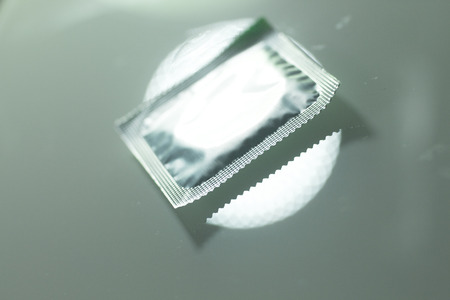 Rubber latex condom male contraceptive for safe disease and pregnancy free sex.の写真素材