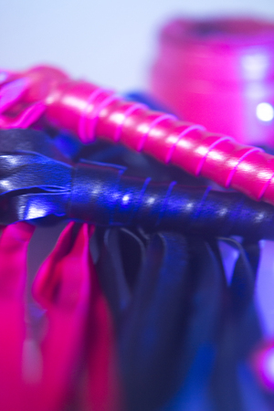 Bondage sadomasochism sex games erotic handcuffs and leather bdsm dominance whip.の写真素材