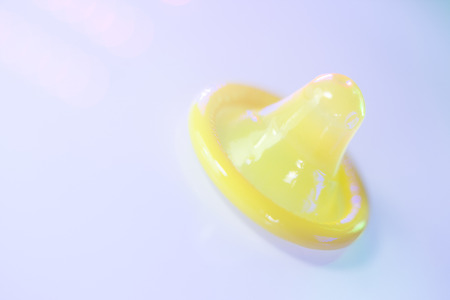 Rubber latex condom male contraceptive for safe disease and pregnancy free sex.