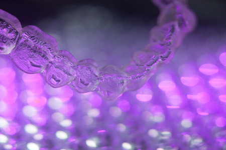 Invisible teeth retainers orthodontic brackets. Plastic modern straighterners to correct tooth...