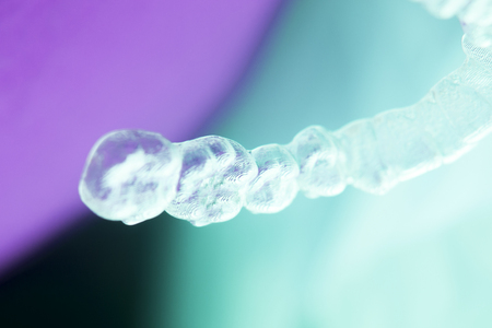 Invisible dental aligners plastic straighteners orthodontic brackets to align and straighten teeth.