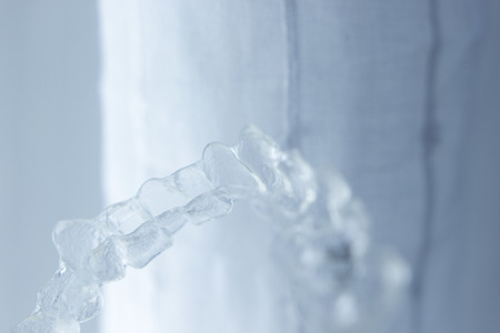 Invisible dental aligners plastic straighteners orthodontic brackets to align and straighten teeth.